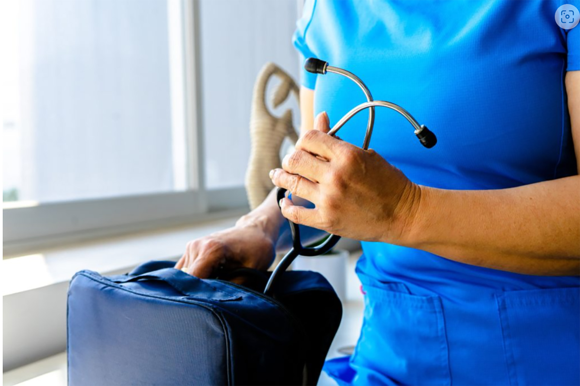 africas-cadiovascular-burden-news a woman in a blue scrub suit holding a stethoscope