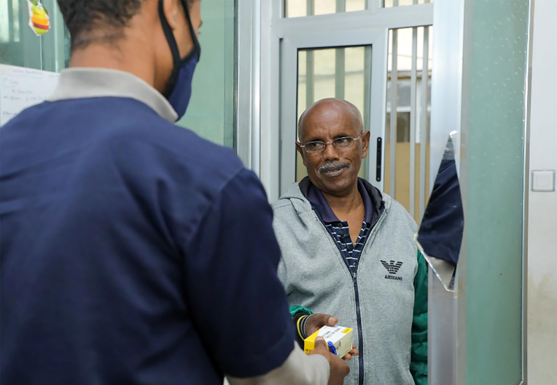 ethiopia-news-story A health worker handing a package to a person