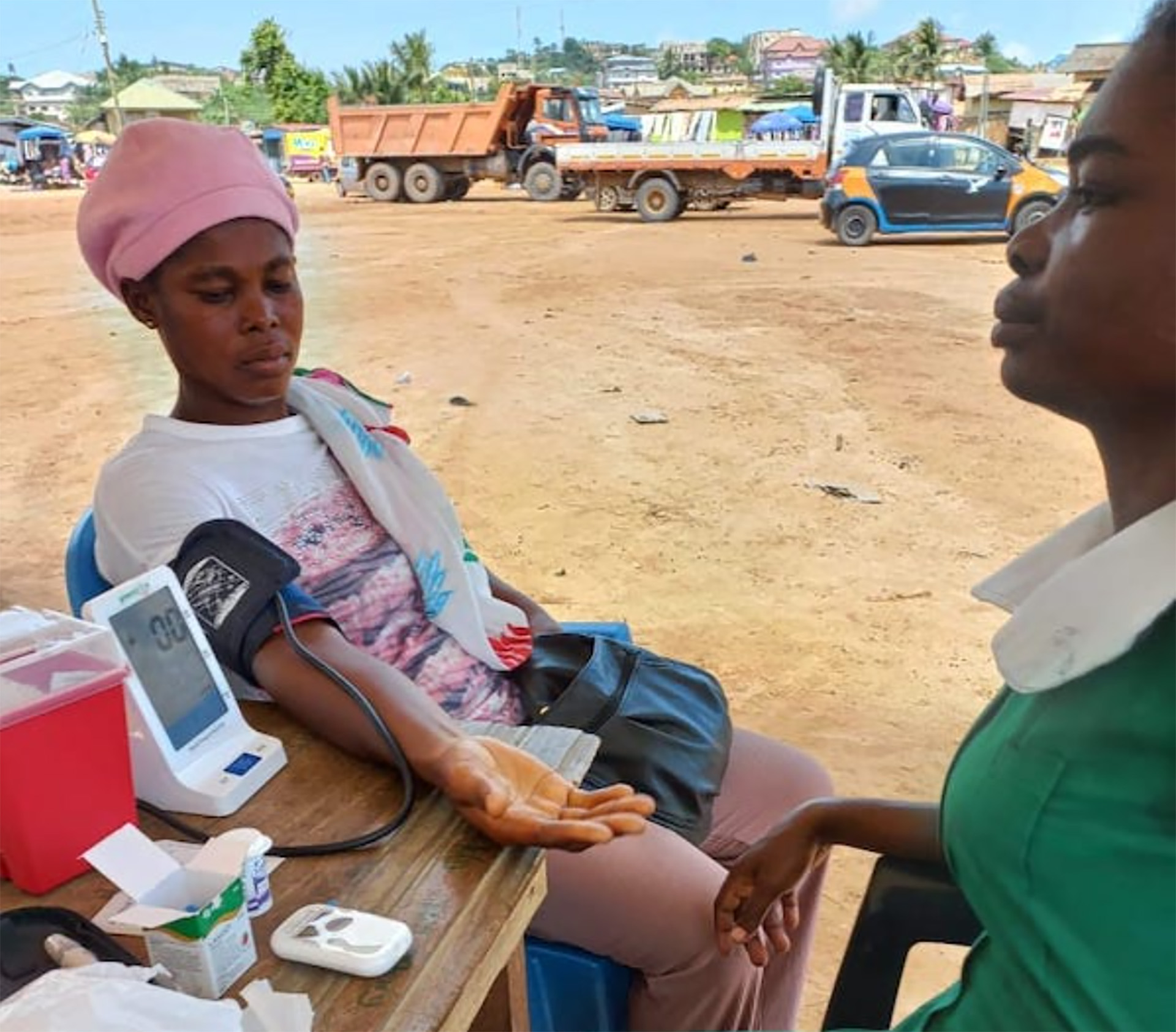 future-proofing-news A person sitting at a table with a blood pressure monitor